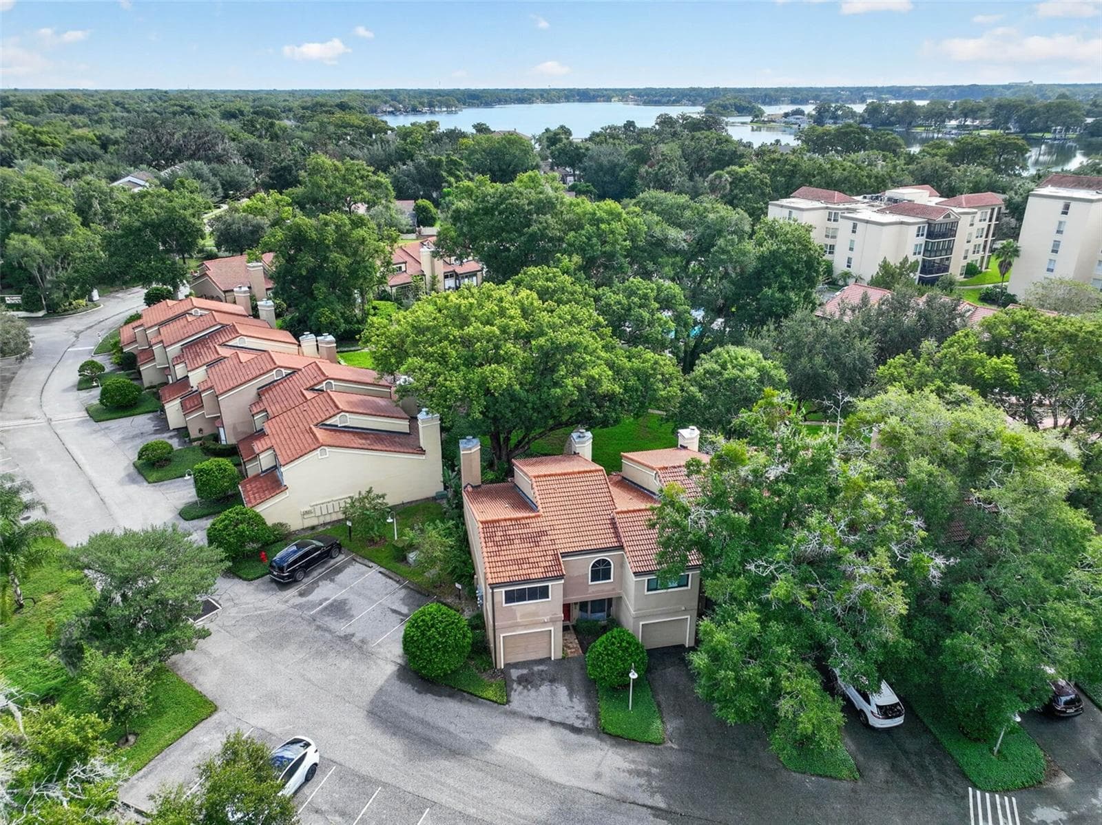 AERIAL VIEW OF TOWNHOME, THE COMMUNITY + LAKE MAITLAND - 223 QUAYSIDE CIR #C11, MAITLAND