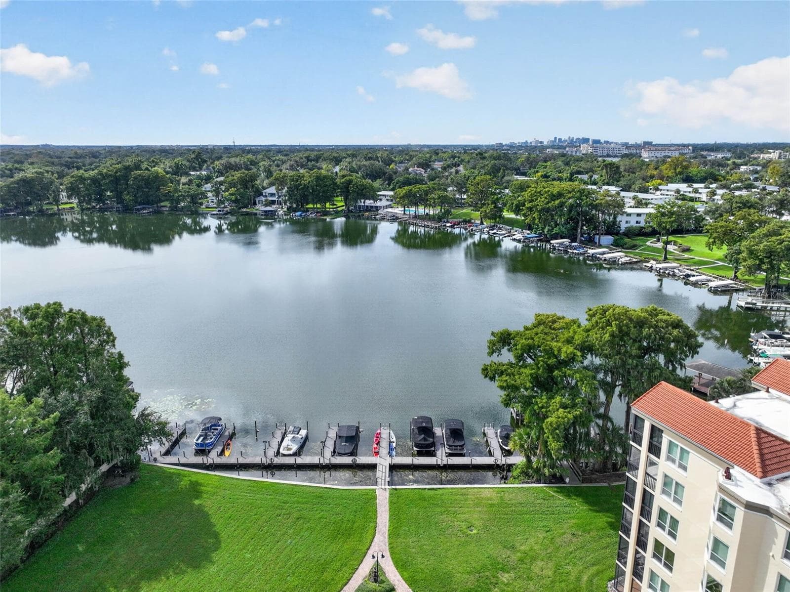 LAKEFRONT AERIAL SHOT WITH COMMUNITY GROUNDS + PRIVATE BOAT SLIPS / DOCK - 223 QUAYSIDE CIR #C11, MAITLAND