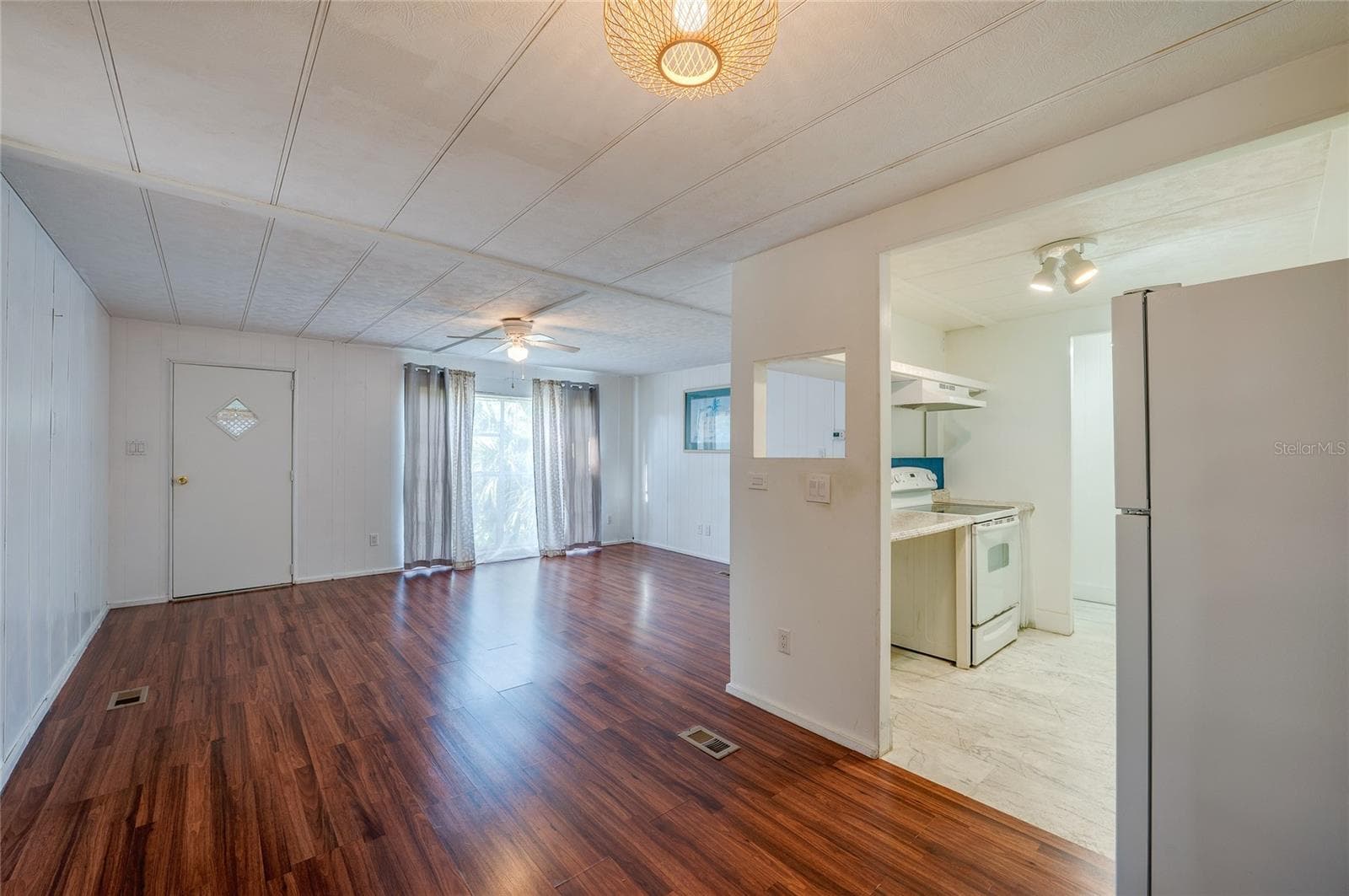 Spacious main living area offers an open layout with abundant natural light and direct connection to the kitchen, creating flexible options for everyday living and dining. - 128 KON TIKI TER, PORT ORANGE