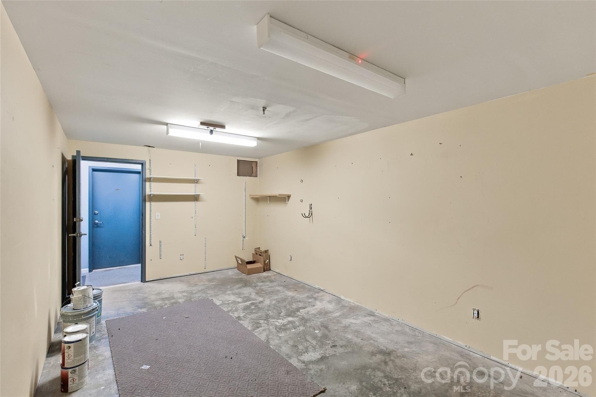 Storage unit is directly across from the garage entry door. - 3564 N Davidson Street, Charlotte