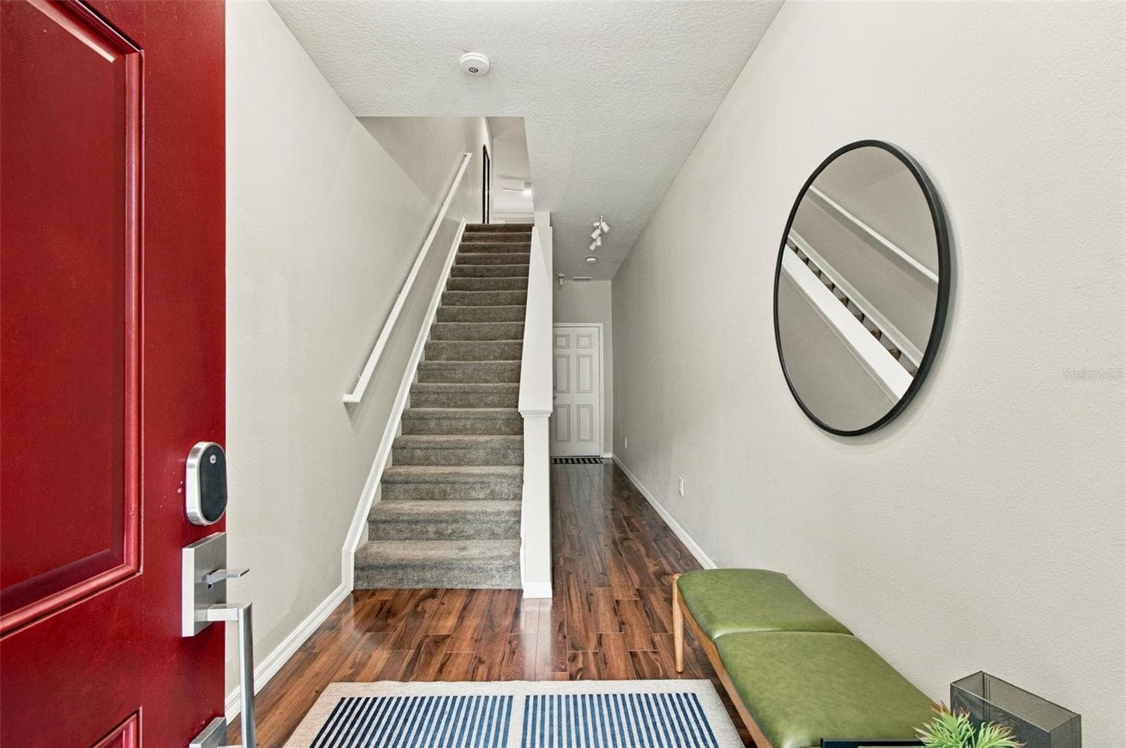 The Foyer - While the Stairs take you up into the condo, they also provide great Extra Storage Underneath! Plus you have Access to the Garage - 9420 GEORGIAN PARK LN #108, TAMPA