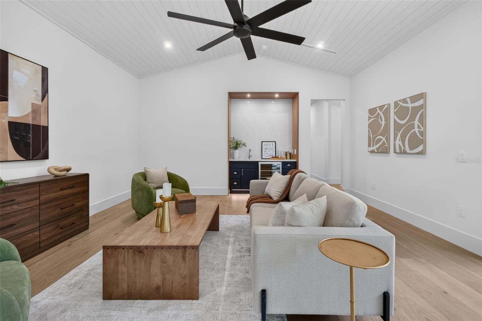 Game room features a wet bar with beverage refrigerator and two large sliding glass doors that provide direct access to pool and covered lanai - 1815 WINDERMERE RD, WINDERMERE