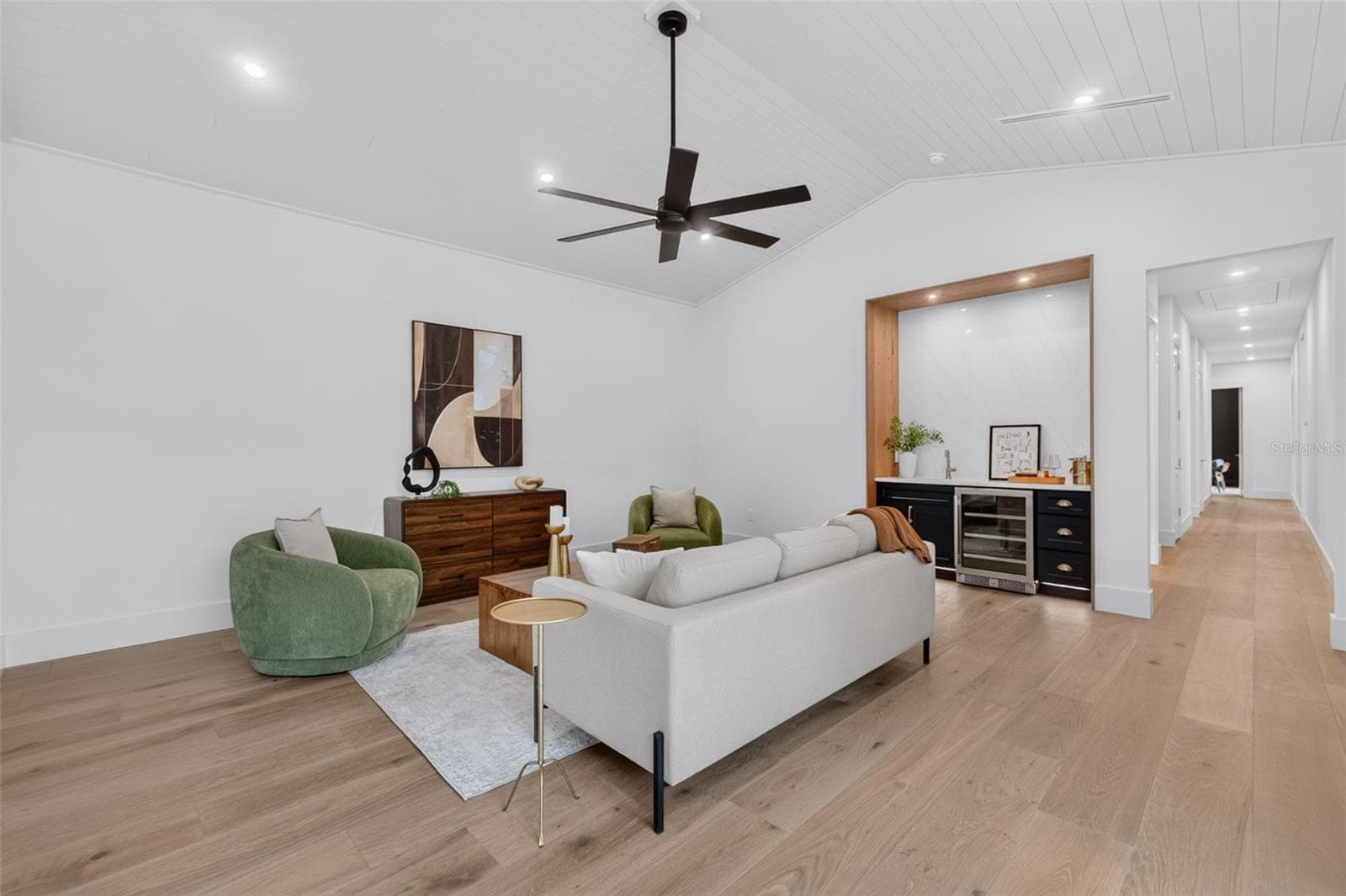 Game room features a wet bar with beverage refrigerator and two large sliding glass doors that provide direct access to pool and covered lanai - 1815 WINDERMERE RD, WINDERMERE