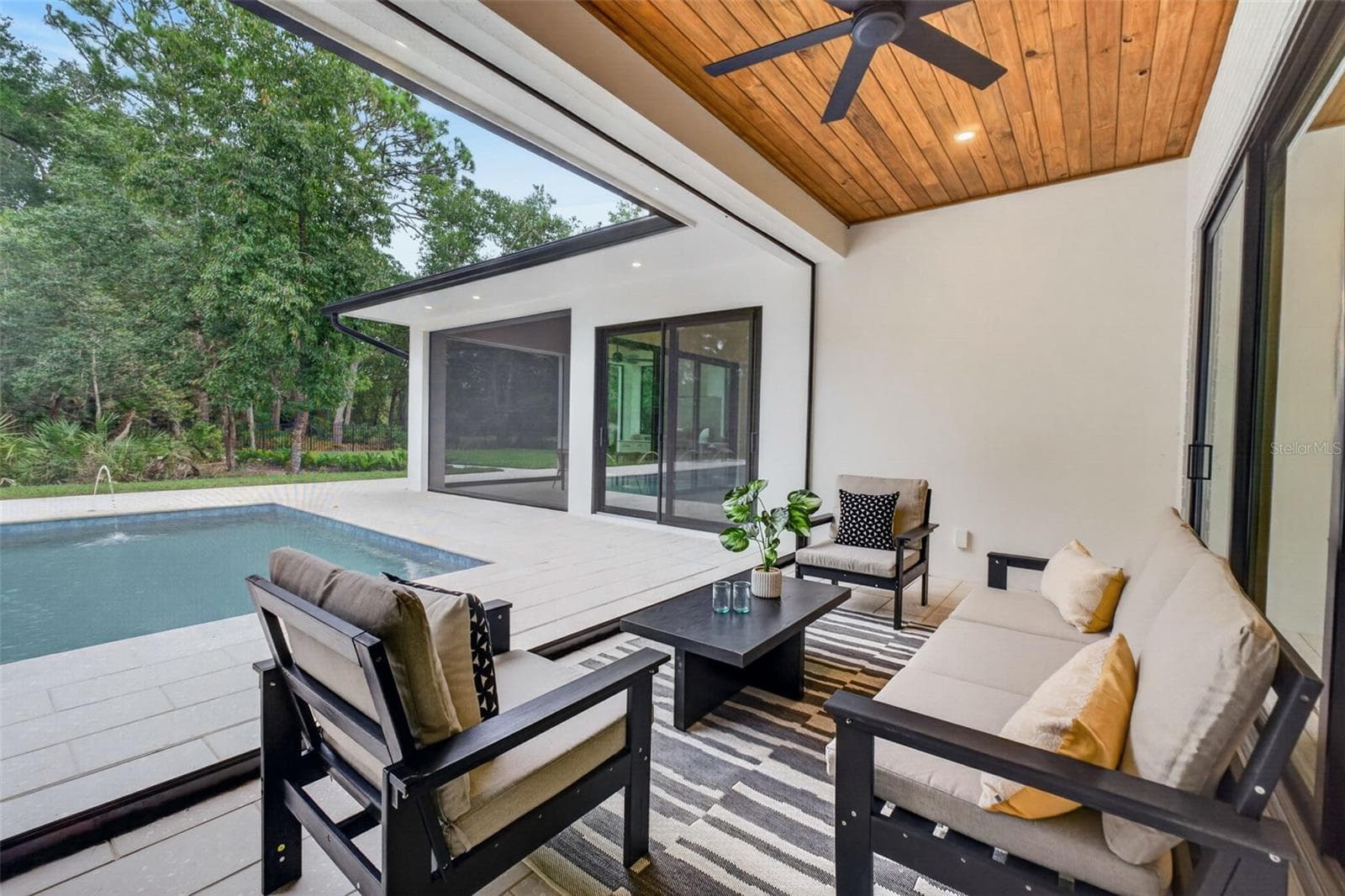 Covered porch with motorized retractable screens - 1815 WINDERMERE RD, WINDERMERE