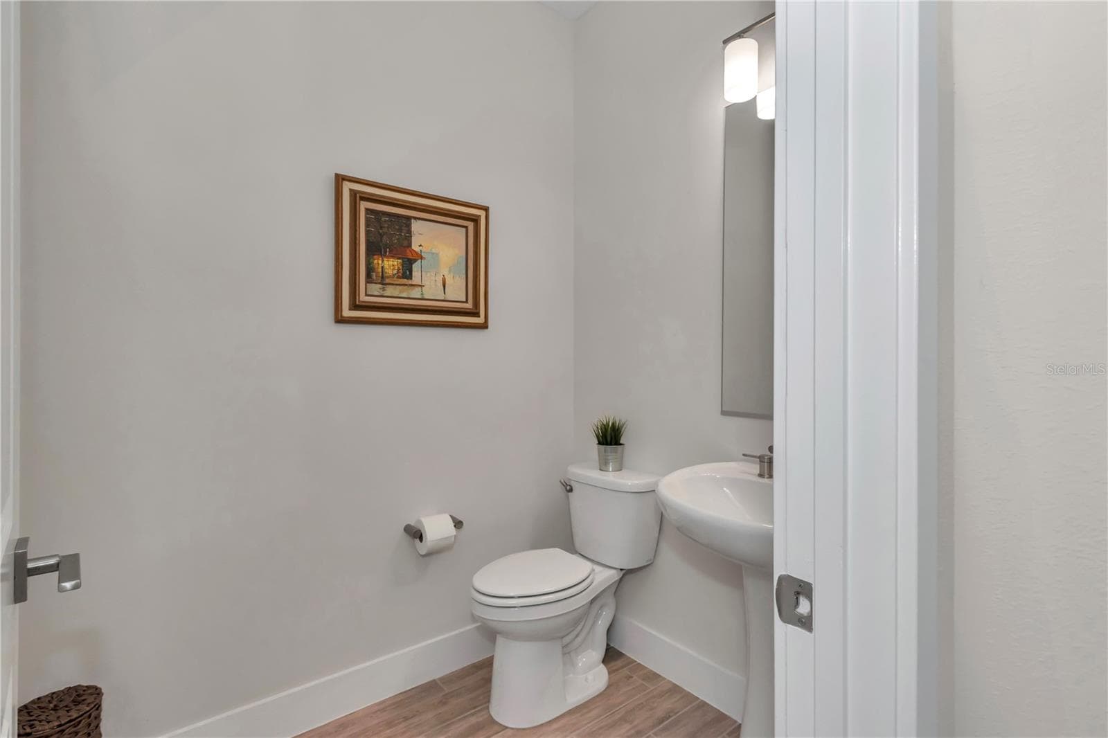 Half bath located off main foyer - 4358 NW 57TH AVE, OCALA