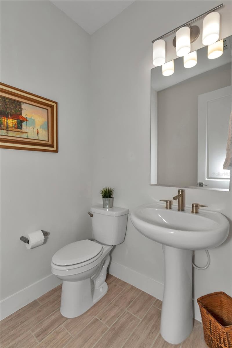 Half bath located off main foyer - 4358 NW 57TH AVE, OCALA