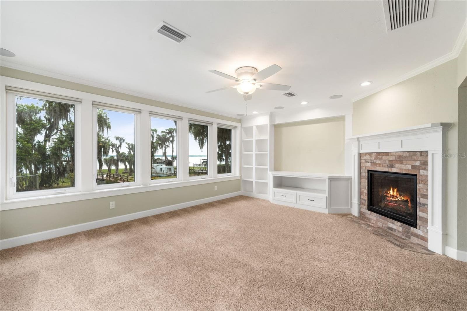 Family room with gas fireplace 2nd floor. View is to lake. - 8026 NE 221ST ST, MELROSE