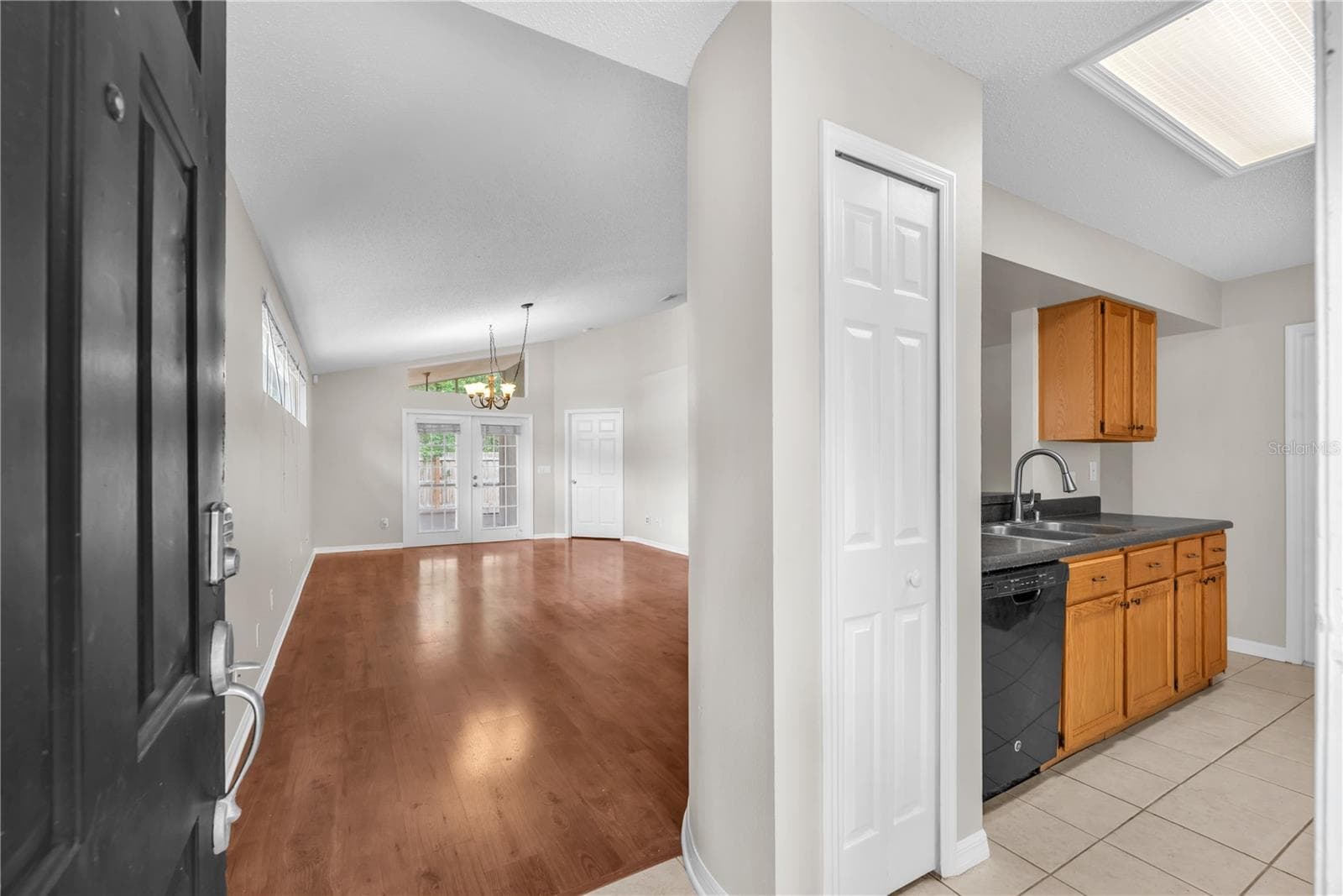 Come in a take a look around. From the foyer, you can see the living/dining area straight ahead and the kitchen is on the right. - 4002 LEVONSHIRE PL, VALRICO
