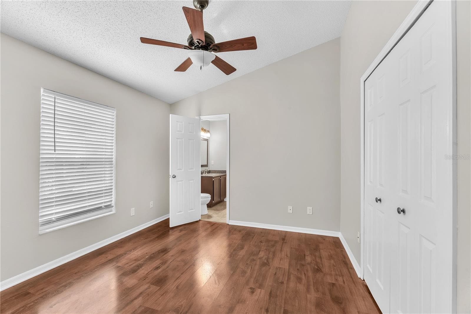 Bedroom 3 has an attached half bath. - 4002 LEVONSHIRE PL, VALRICO