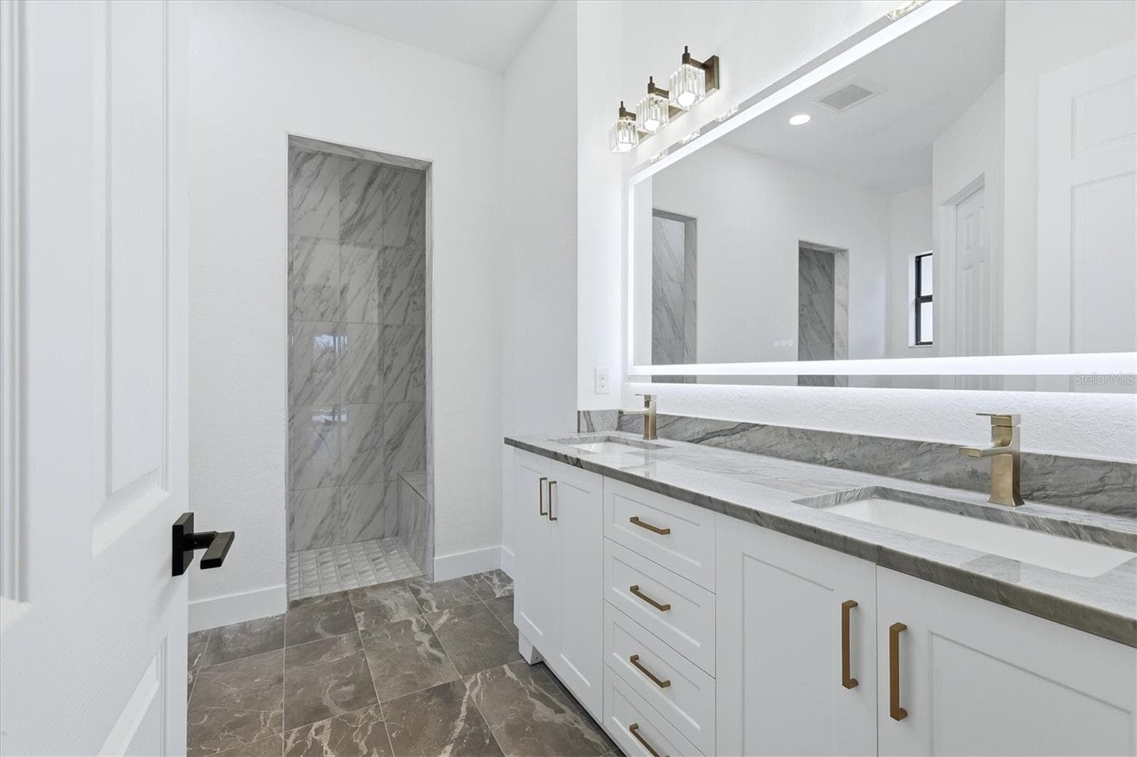 primary bath with lighted mirror - 15417 AVERY RD, PORT CHARLOTTE