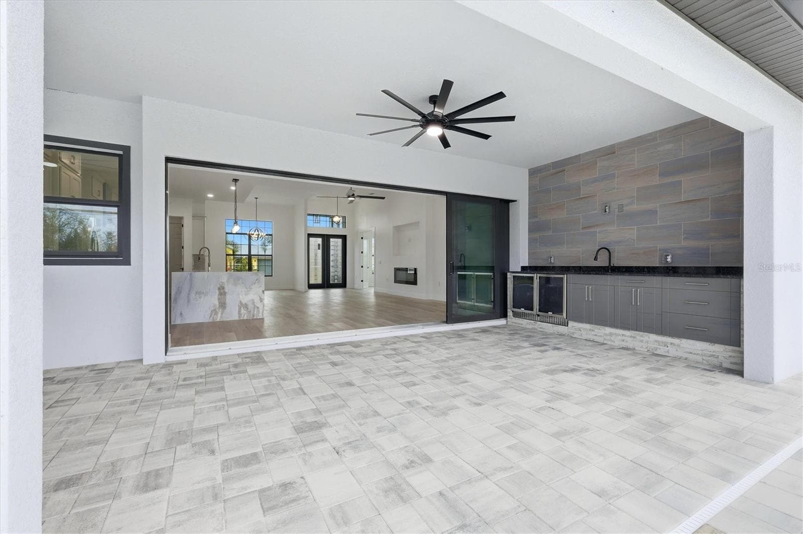 Hideaway slider doors make inside and outside entertaining easy - 15417 AVERY RD, PORT CHARLOTTE
