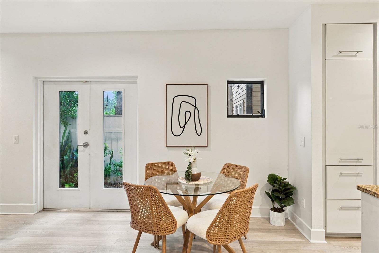 And dinette with French doors leading to side yard - 213 S MOODY AVE #1, TAMPA