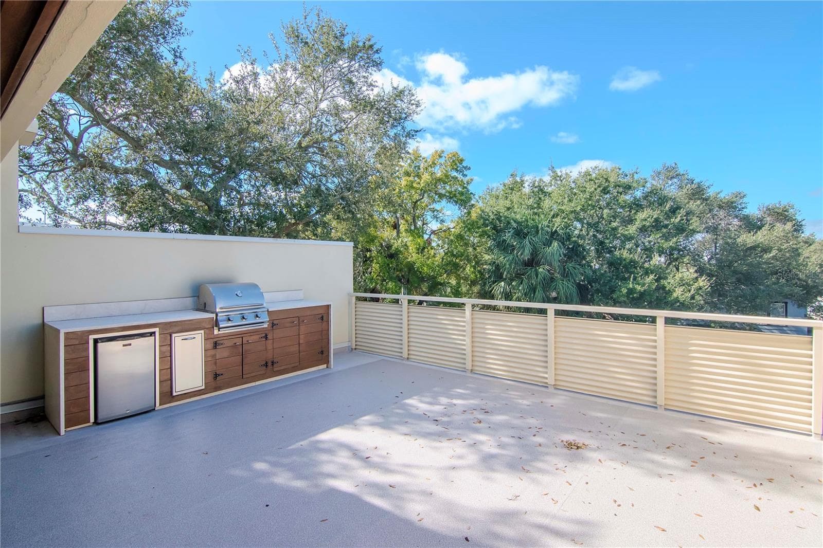 featuring an outdoor kitchen with grill and fridge - 213 S MOODY AVE #1, TAMPA