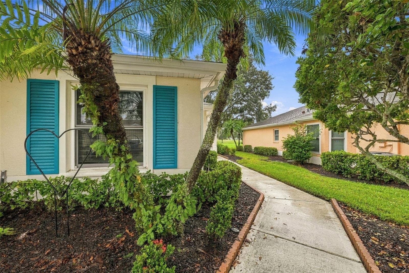 Walkway to the side door - 2333 BROOKFIELD GREENS CIR #45, SUN CITY CENTER