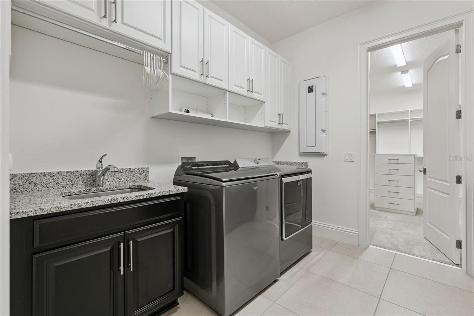 Laundry Room is conveniently adjoined to the primary bedroom closet - 10840 MOBBERLEY CIR, ORLANDO