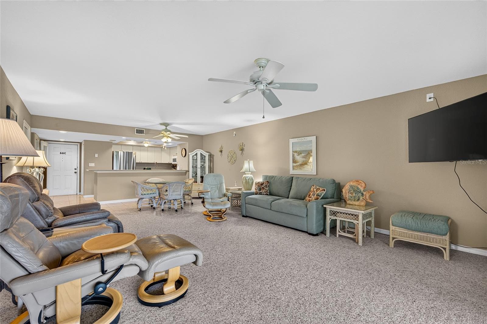 Living room, looking toward front door - 601 SHREVE ST #66C, PUNTA GORDA