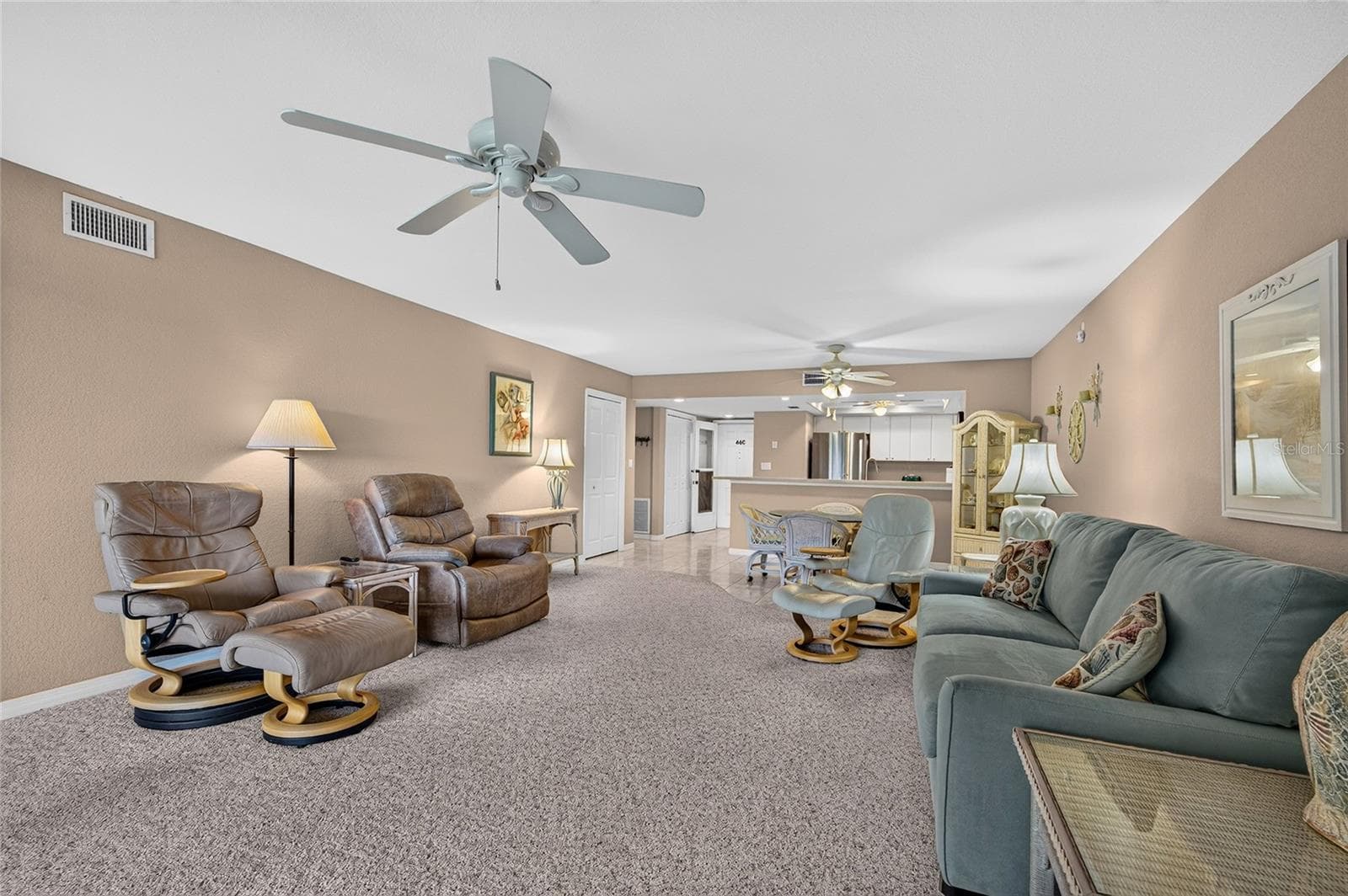 Living room, looking toward front door - 601 SHREVE ST #66C, PUNTA GORDA