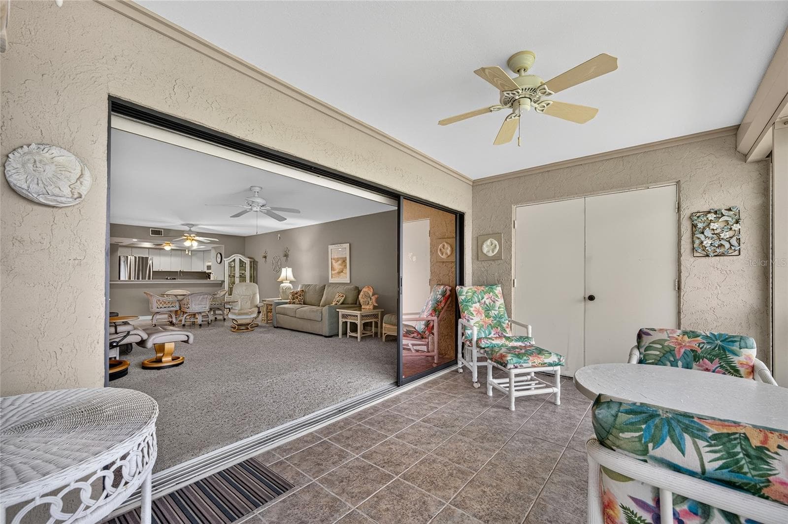 Triple sliders open the indoors to outdoor space - 601 SHREVE ST #66C, PUNTA GORDA