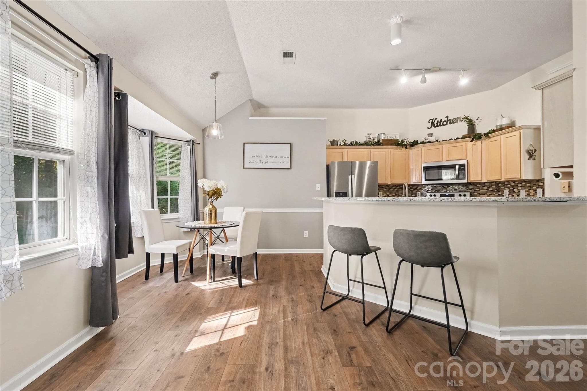 Dining and kitchen breakfast bar - 11609 Long Forest Drive, Charlotte