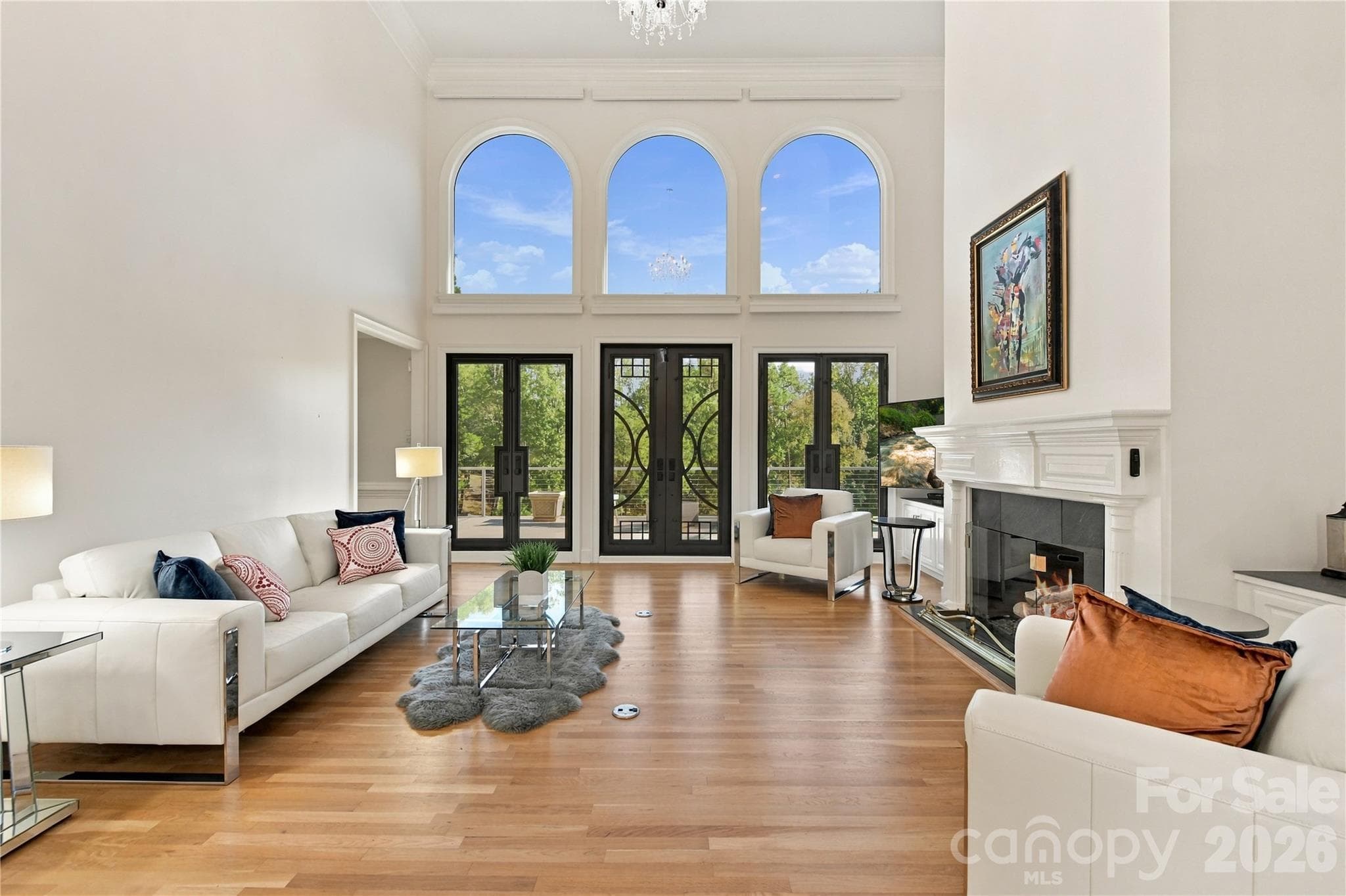Wow! The light coming in these custom doors and windows with Hunter Douglas remote shades is just phenomenal. - 2723 Providence Pine Lane, Charlotte