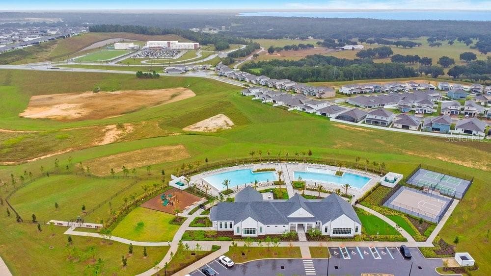 Amenities Center with Minneola Horizon Academy and Lake Apopka in the Distance - 2378 GOLD DUST DR, MINNEOLA