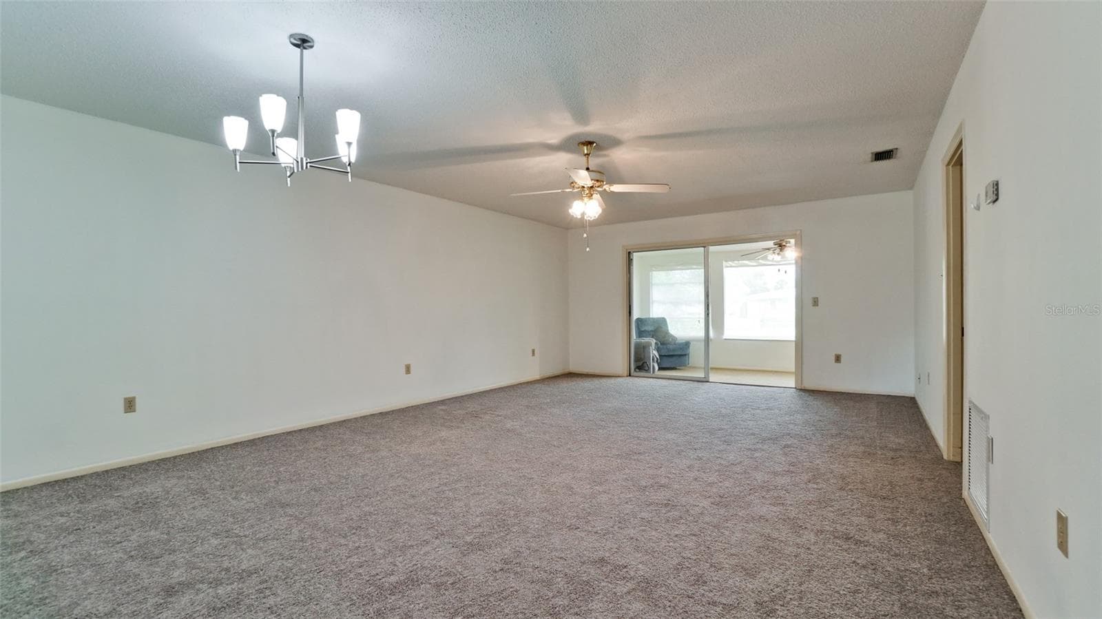 Living/dining combination with new carpeting - 7110 11TH AVE W, BRADENTON
