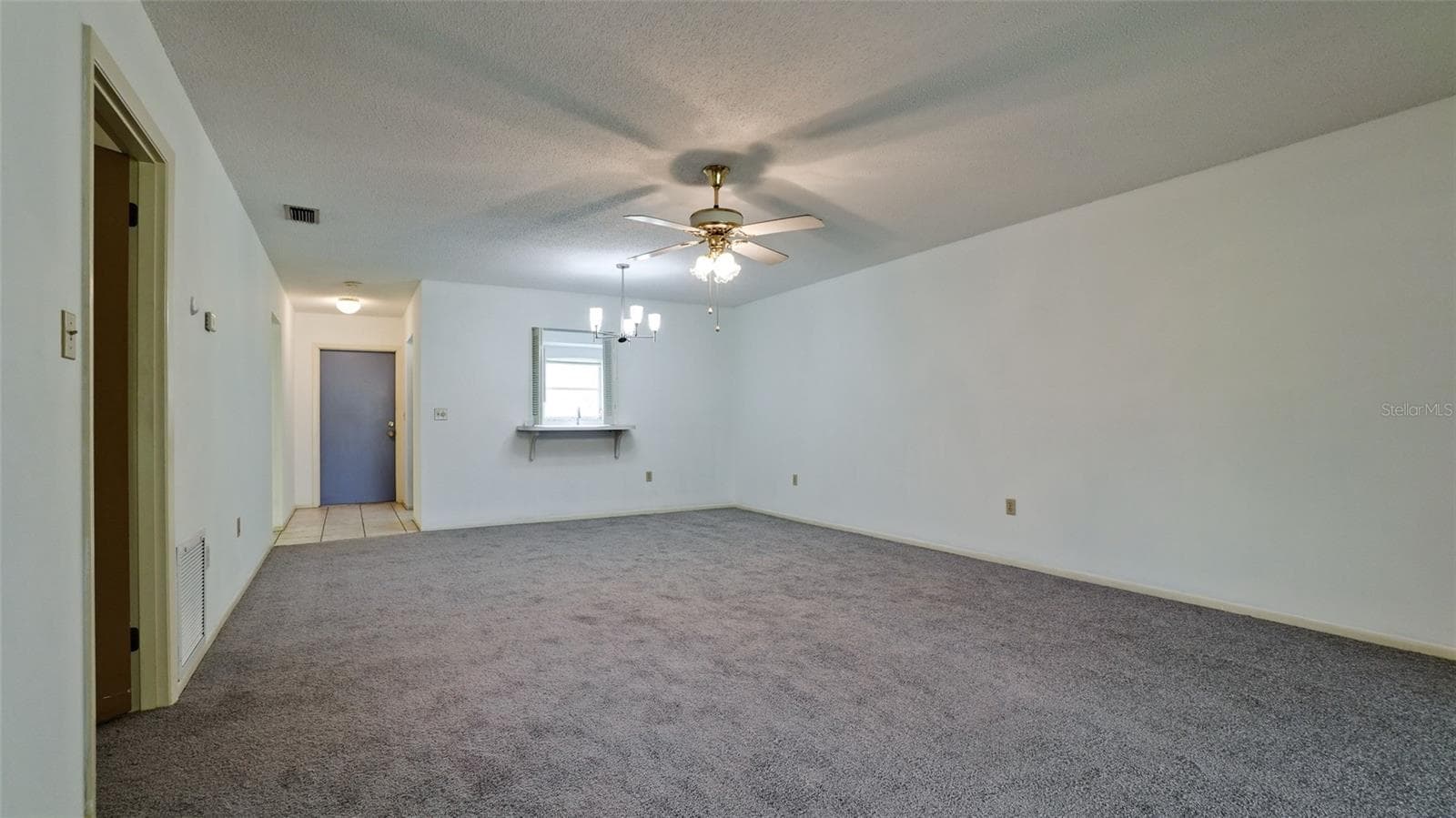 Main door into garage with front door beyond it. Pass through is to the kitchen - 7110 11TH AVE W, BRADENTON