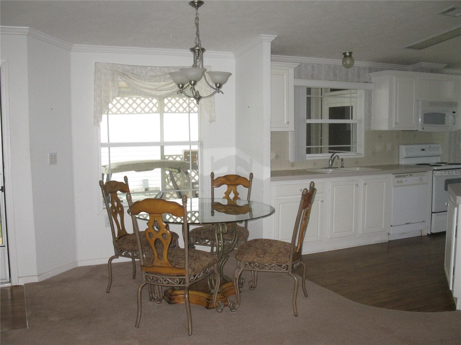 dining area off kitchen and open to livingroom - 212 YORK COTTAGE DR, HAINES CITY