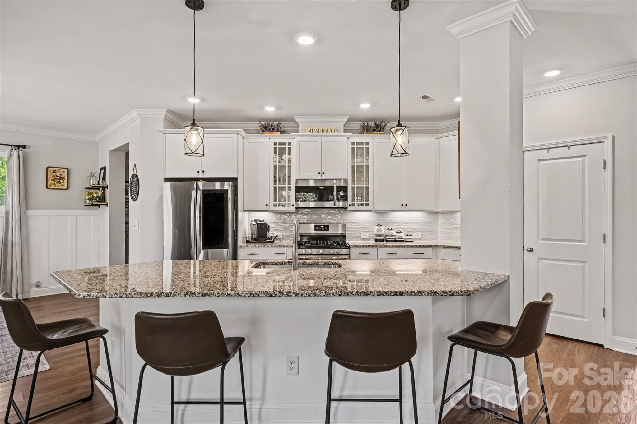 The heart of the home! A bright, open kitchen with a spacious island and plenty of room to gather. - 2703 Wedgewood Court, Denver