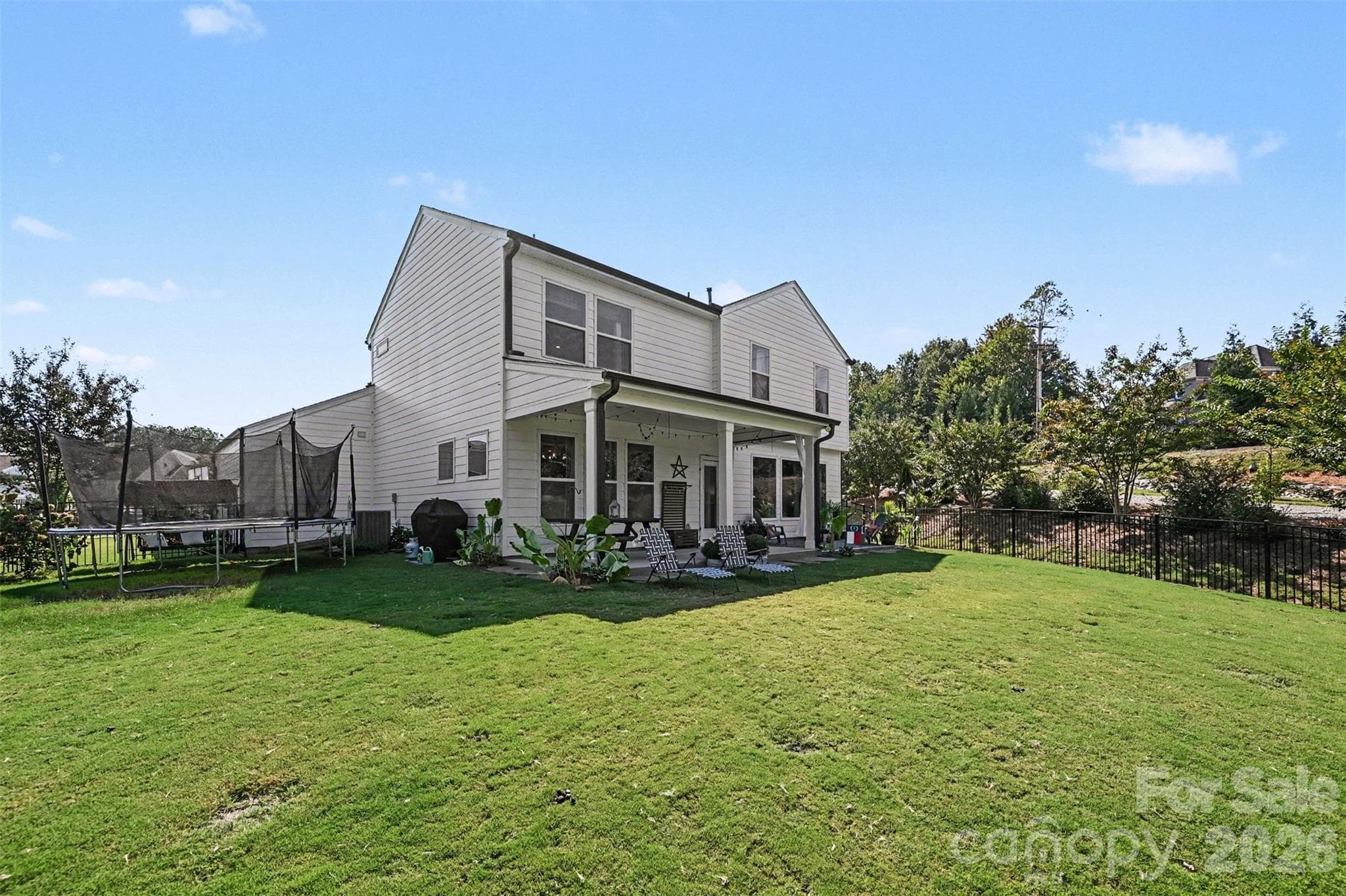 A big, open backyard with room to play, garden, or entertain. - 2703 Wedgewood Court, Denver