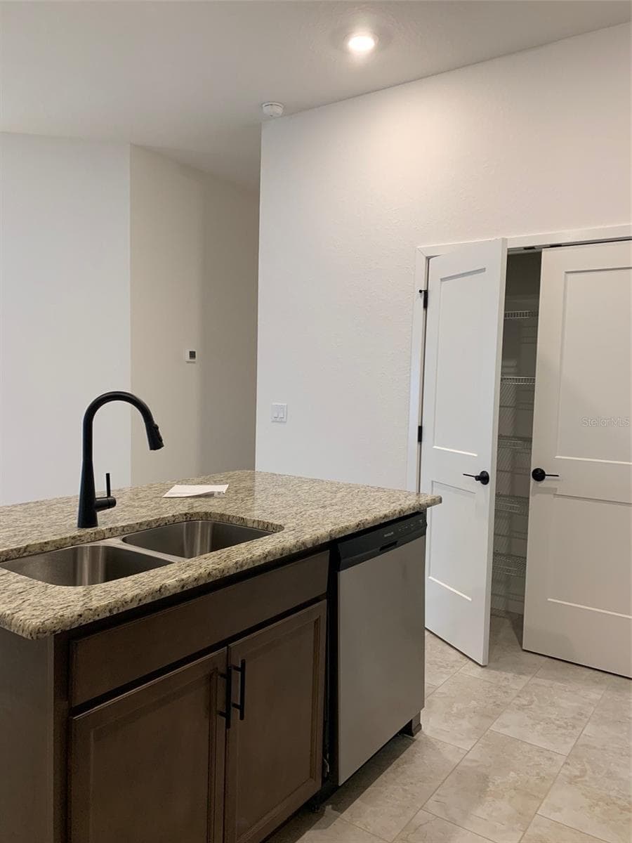 kitchen island and pantry - 11611 GRACE RD, WEEKI WACHEE