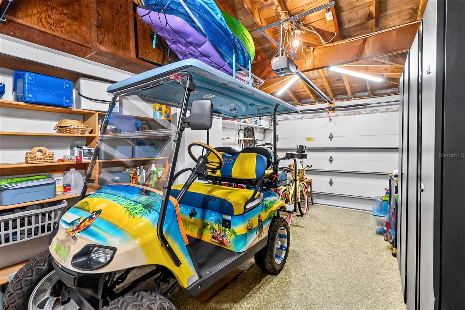 Alternate garage view. Golf cart excluded; available for separate purchase. - 912 CHURCH ST, VENICE
