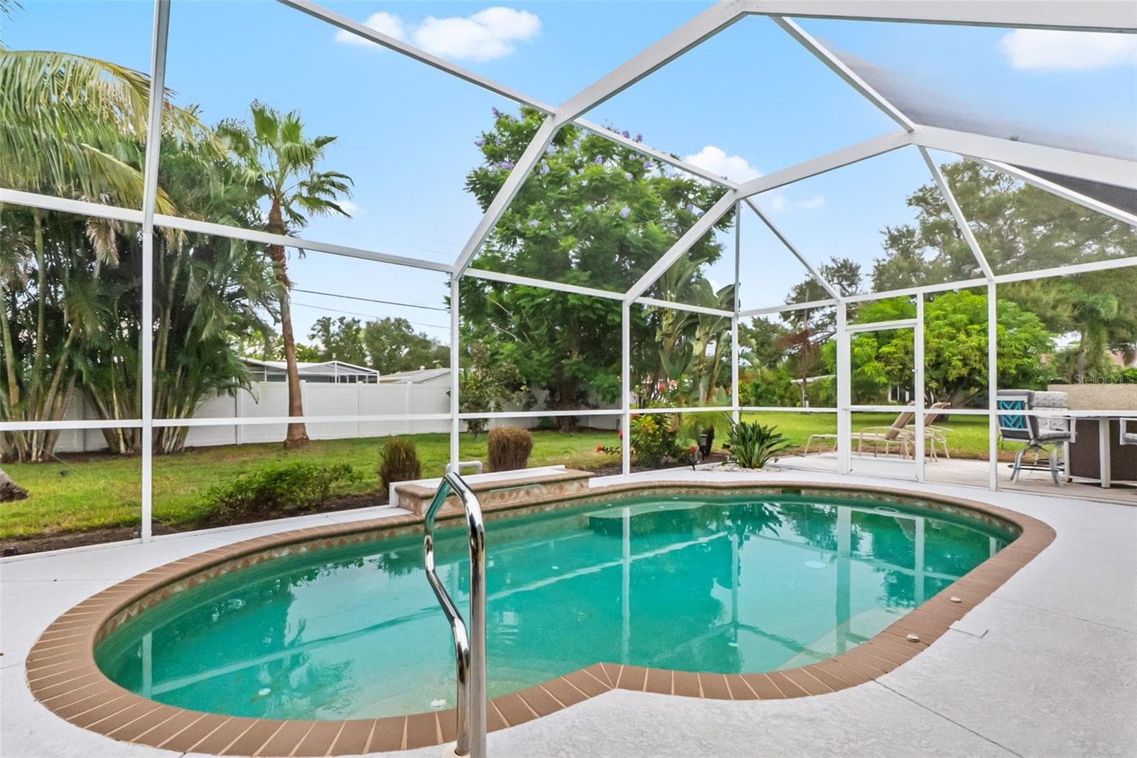 Screened swimming pool with patio space. - 912 CHURCH ST, VENICE