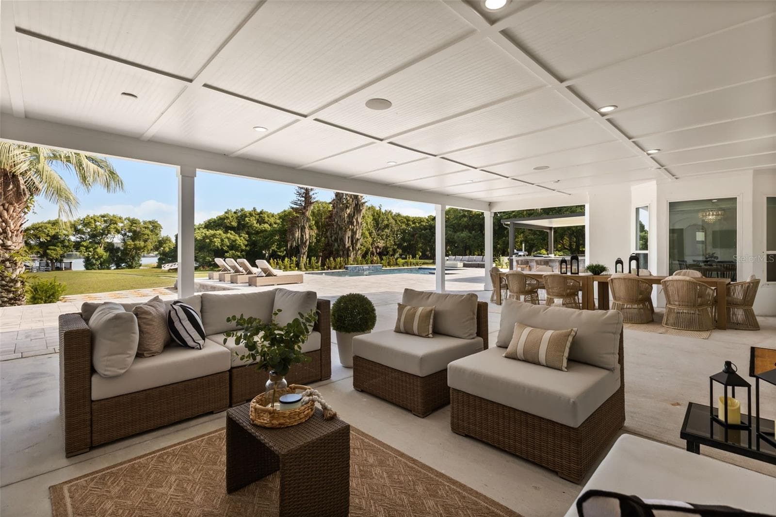 Lanai Sitting Area, Dining Area, and Pool - 7703 SADLER RD, MOUNT DORA