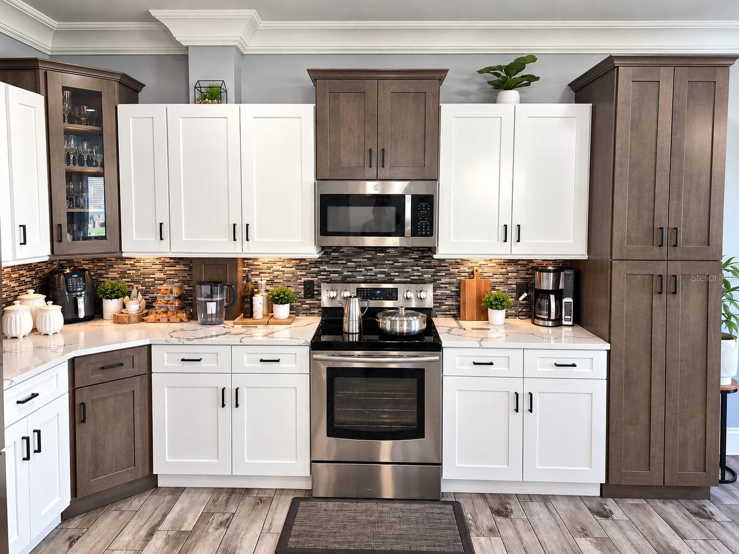 Additional kitchen view highlighting cabinetry and finishes. - 3998 PEMBERLY PINES CIR, ST CLOUD
