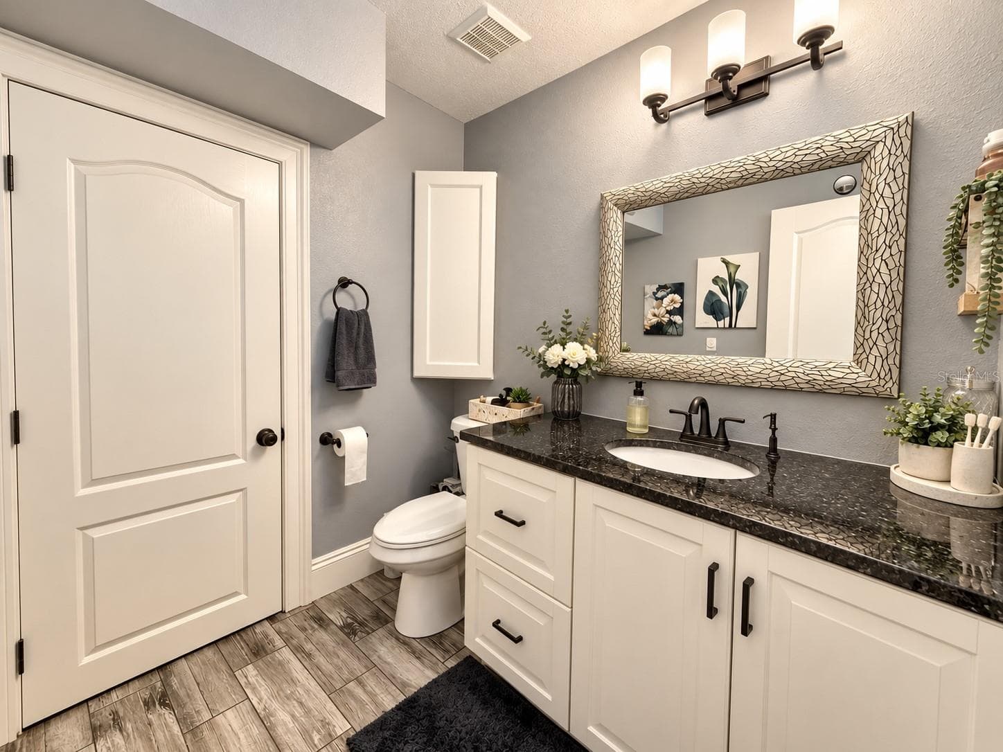 Bathroom with vanity and storage. - 3998 PEMBERLY PINES CIR, ST CLOUD