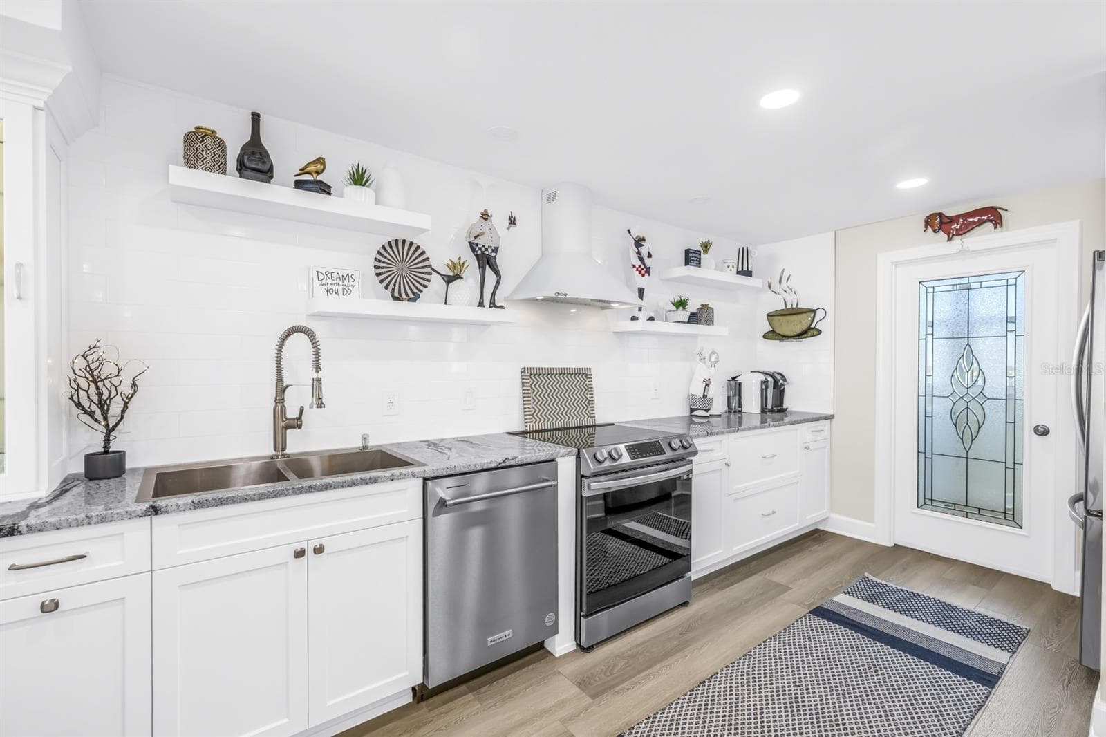 Kitchen with Glass Door to Pantry and Laundry Room - 15462 GULF BLVD #1006, MADEIRA BEACH