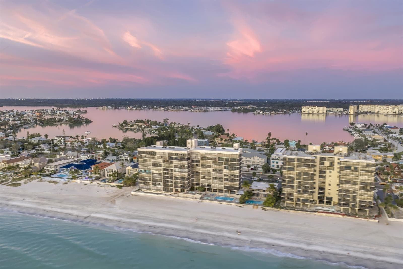 Pink skies, glassy water, and a view that feels almost too beautiful to be real - 15462 GULF BLVD #1006, MADEIRA BEACH