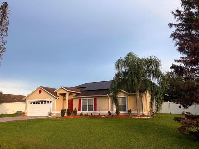 Front view from the right side including front vinyl fence for the rear patio. This is half acre lot... it is a large fence. - 4030 SANTA BARBARA RD, KISSIMMEE