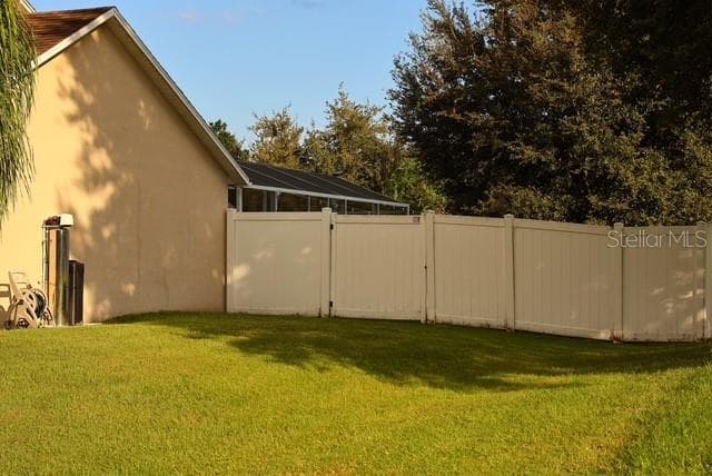 Rear view of the fence from the rear patio - 4030 SANTA BARBARA RD, KISSIMMEE