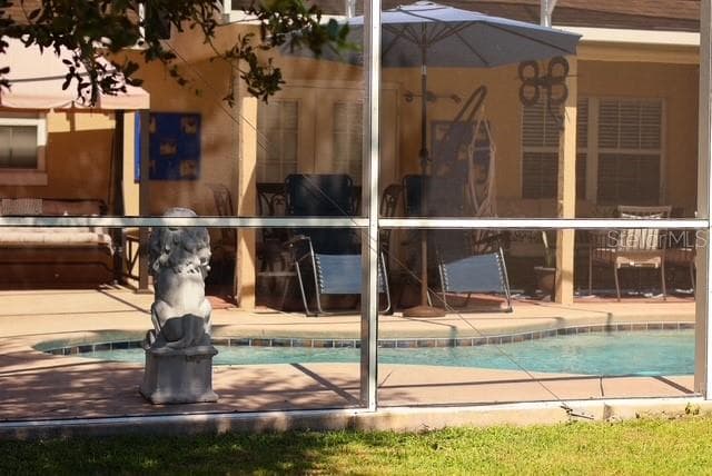 Pool and screened Porch view from the back - 4030 SANTA BARBARA RD, KISSIMMEE