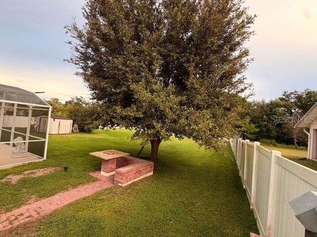 Paved walk way to the shaded Picnic area in front of the Pool enclosure Entertainment at its best after BBQ is ready. - 4030 SANTA BARBARA RD, KISSIMMEE