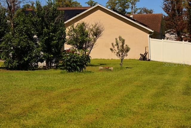 Rear patio from the right side of the garage - 4030 SANTA BARBARA RD, KISSIMMEE