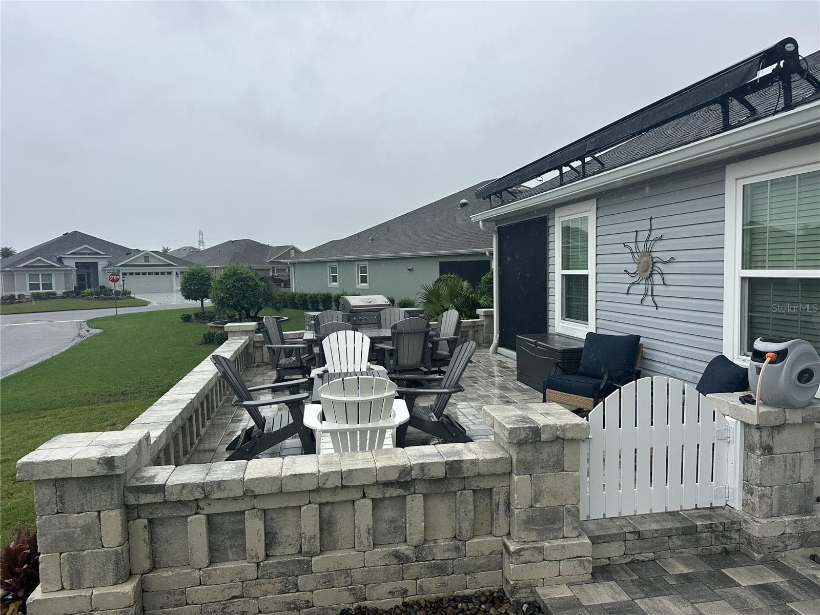 Upgraded side view with pavers and awning. - 3342 VELTRE WAY, THE VILLAGES