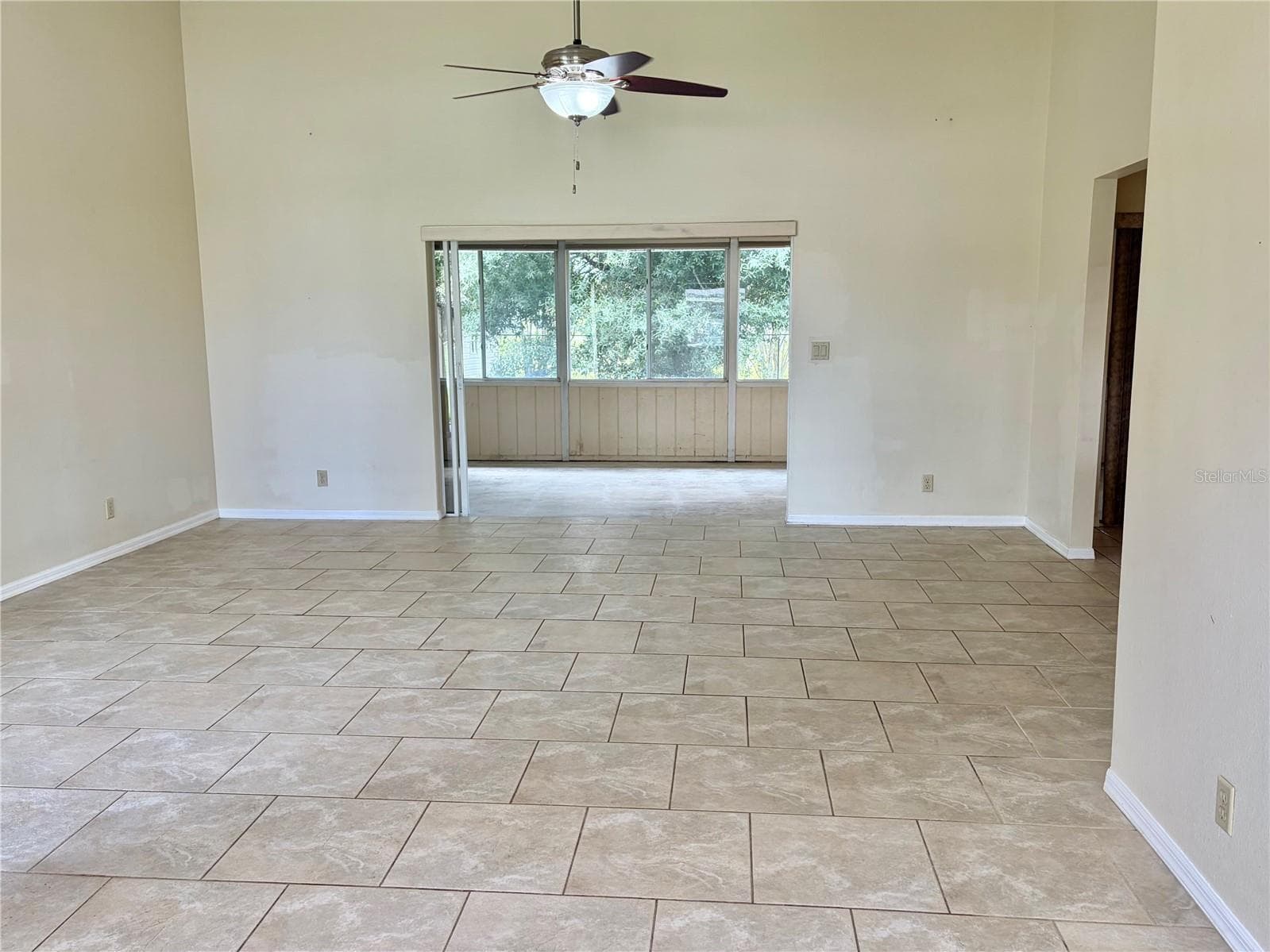 Living Room with Tile Floor - 8123 BESSEMER AVE, NORTH PORT