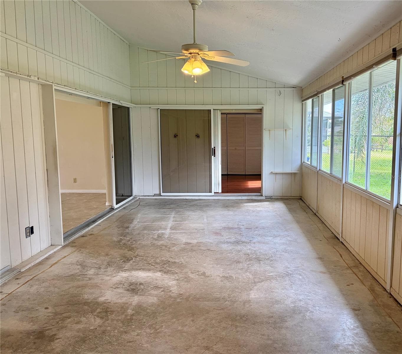 Florida Room with Windows Across Back and split AC system - 8123 BESSEMER AVE, NORTH PORT