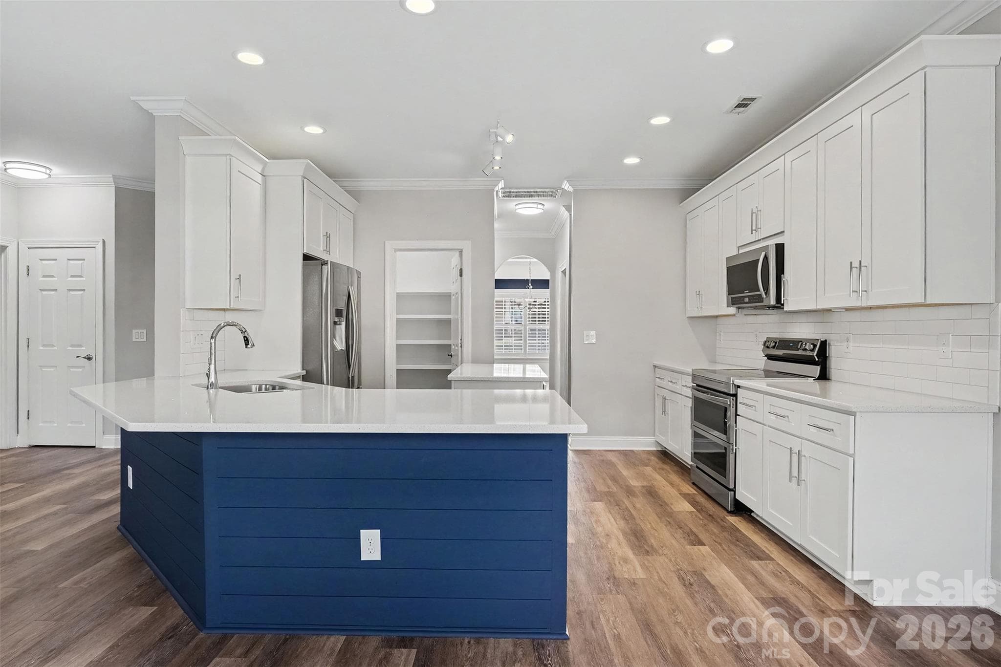 Walk-in pantry with wooden shelving - 1006 Triple Crown Drive, Indian Trail