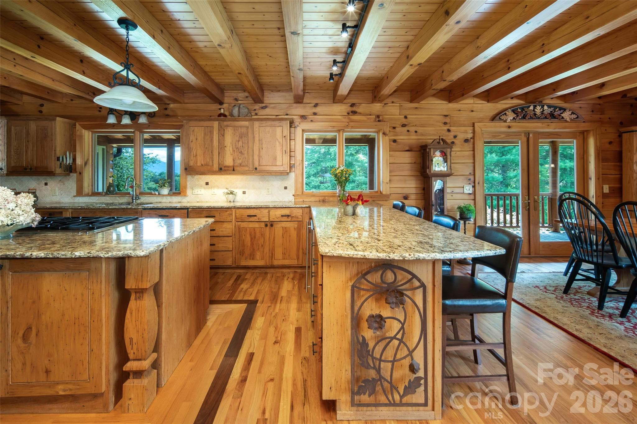 Granite countertops. Primary kitchen with island and peninsula. - 316 Stevenson Cove Road, Waynesville