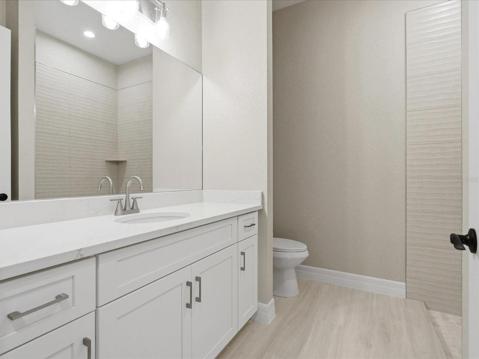 Guest Bathroom with tiled shower & linen closet - 51 LONG MEADOW PL, ROTONDA WEST