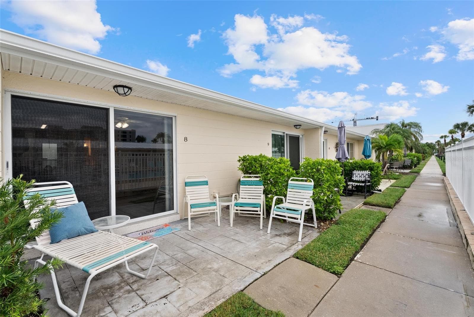 Back patio is upgraded with pavers - 5830 MIDNIGHT PASS RD #8, SARASOTA